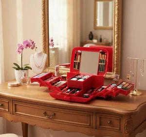 Red makeup organizer box with mirror and cosmetics on vanity table in elegant bedroom